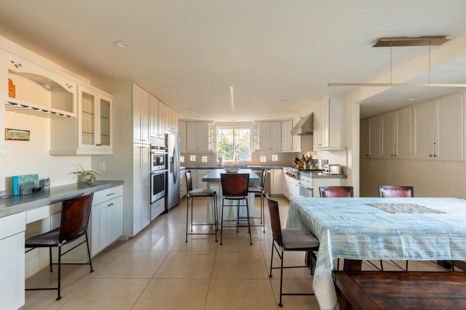 Fully stocked kitchen with state of the art appliances. Ample room for seating.