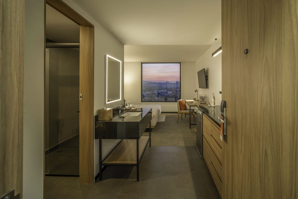 Shower, designer toiletries, hair dryer, towels