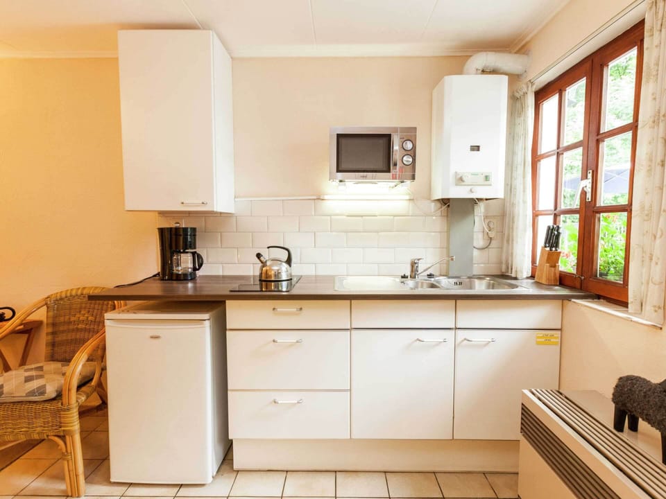 Apartment | Private kitchen | Stovetop, highchair