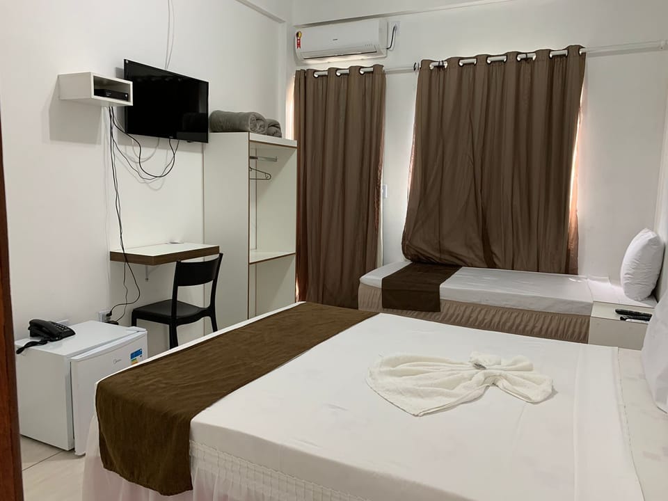 Standard Triple Room | Minibar, desk, laptop workspace, blackout drapes