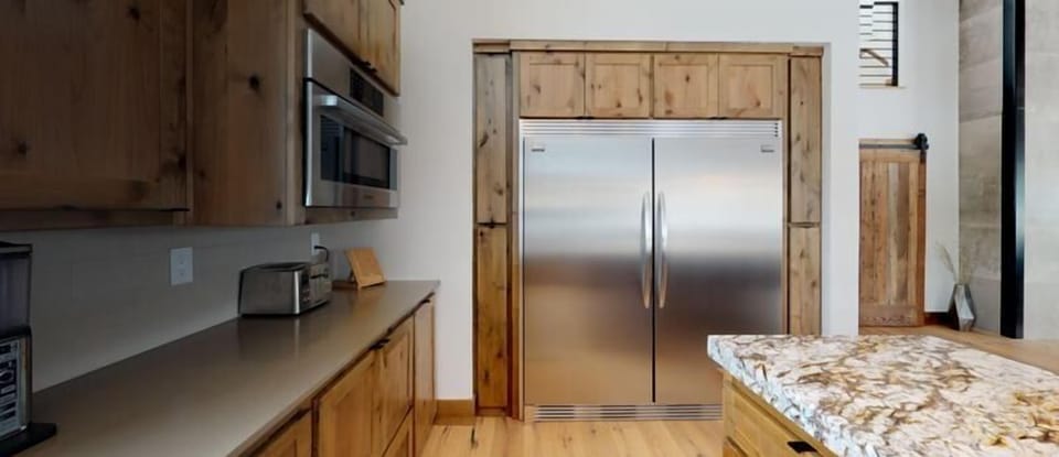 Extra-large side-by-side refrigerator/freezer.