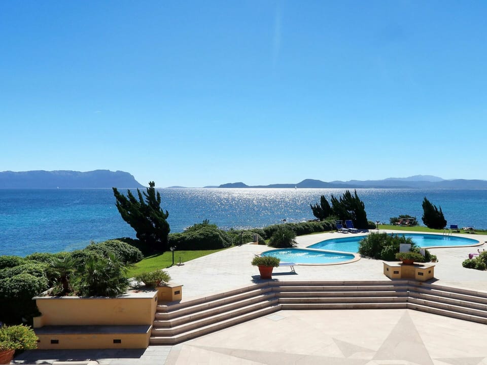 Water, Sky, Plant, Property, Azure, Building, Seaside Resort, Outdoor Furniture, Arecales, Leisure