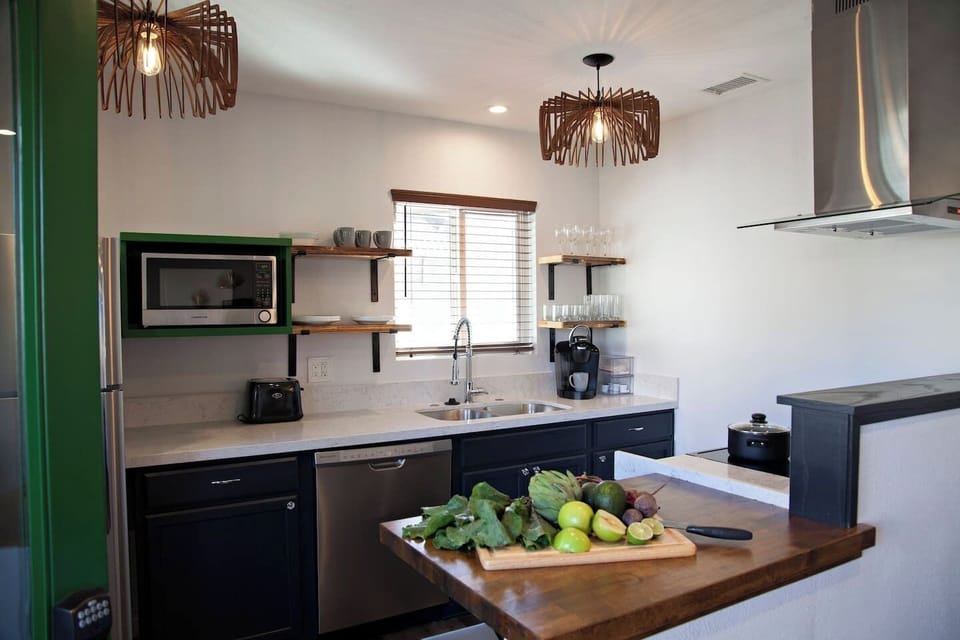 15. Modern Gallery Kitchen Opens to the Main Living Area.