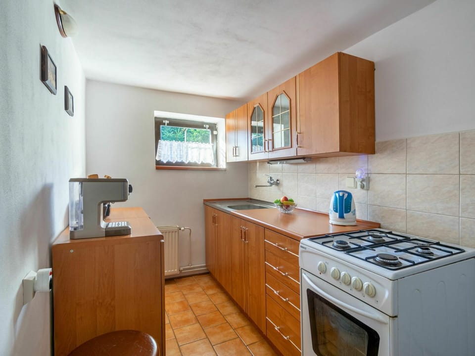 Cabinetry, Countertop, Property, Kitchen Sink, Sink, Kitchen Stove, Kitchen Appliance, Home Appliance, Kitchen, Drawer