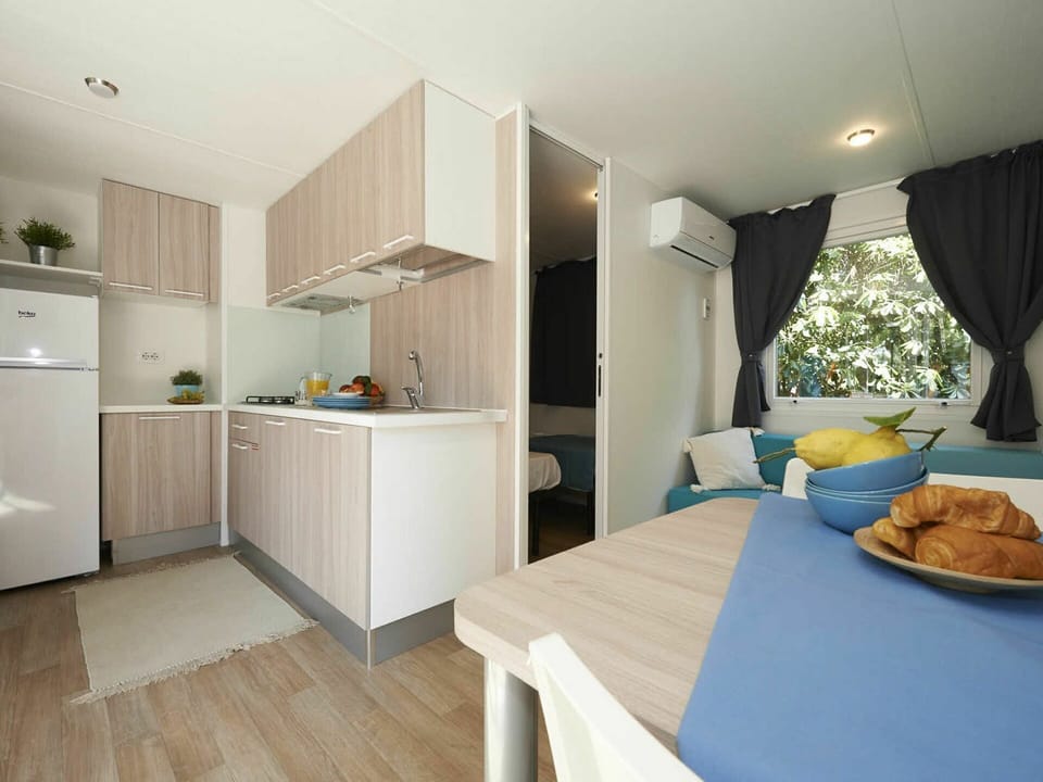 Table, Furniture, Cabinetry, Plant, Wood, Interior Design, Lighting, Comfort, Tableware, Flooring