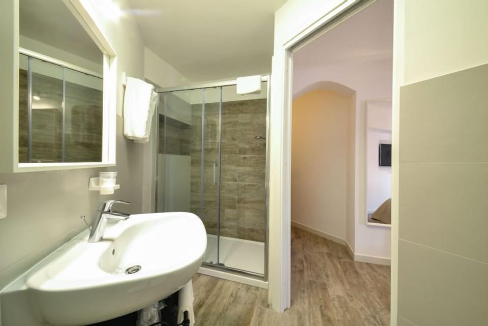 Quadruple Room | Bathroom | Shower, free toiletries, hair dryer, bathrobes