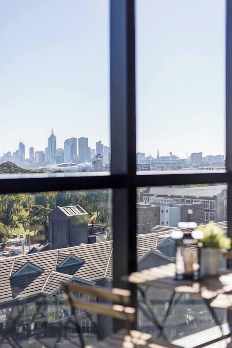 The balcony is a perfect place to sit with a wine and admire beautiful Melbourne and the view of the Yarra and sporting precinct