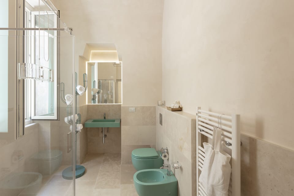 Deluxe Double Room, Balcony, Partial Sea View (Trabucco) | Bathroom | Shower, free toiletries, hair dryer, bathrobes