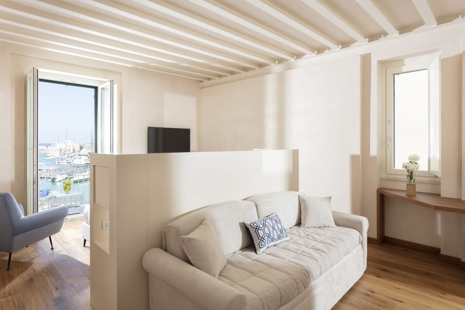 Executive Quadruple Room, Balcony, Harbor View (Le Sciale) | Living area | Flat-screen TV