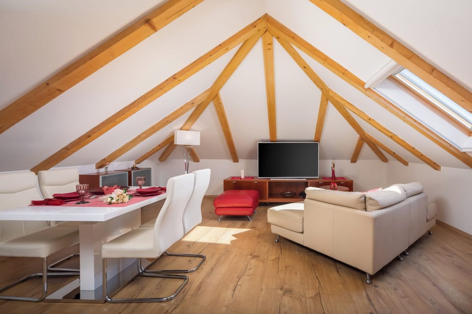 Deluxe Apartment, City View | Living area | Flat-screen TV