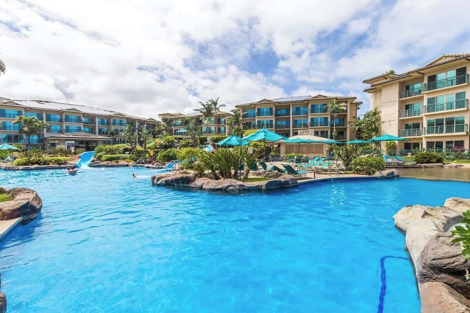 Large pool, and plenty of seating with umbrellas await you and your family