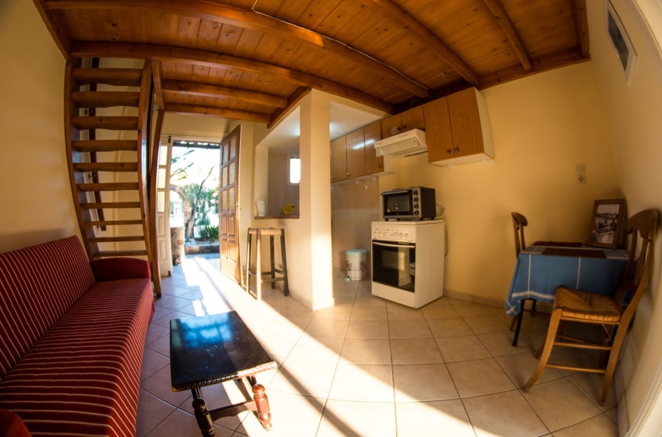 Apartment, Sea View | Living area | 22-inch TV with digital channels