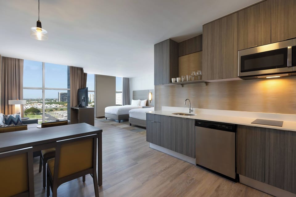 Studio, 2 Queen Beds, City View | Private kitchen | Coffee/tea maker, full-size fridge, microwave, stovetop