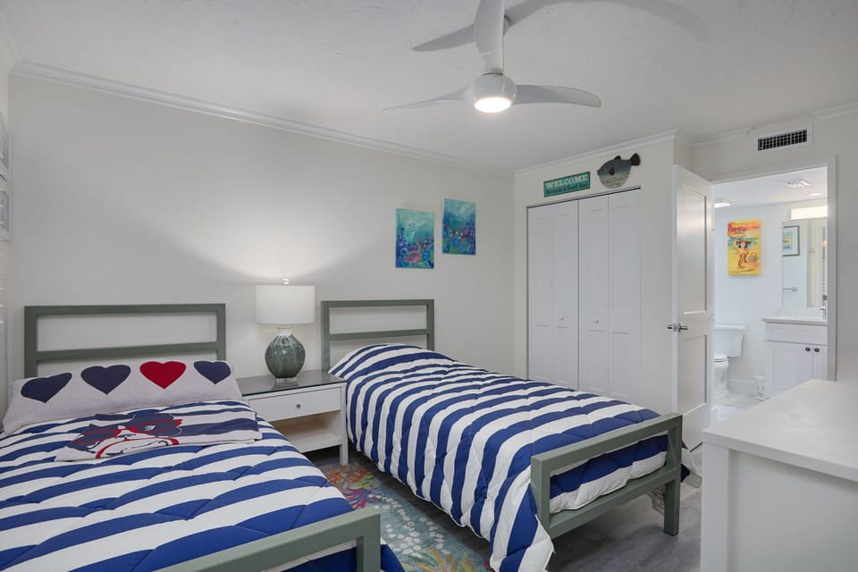 Bedroom two with two double beds.