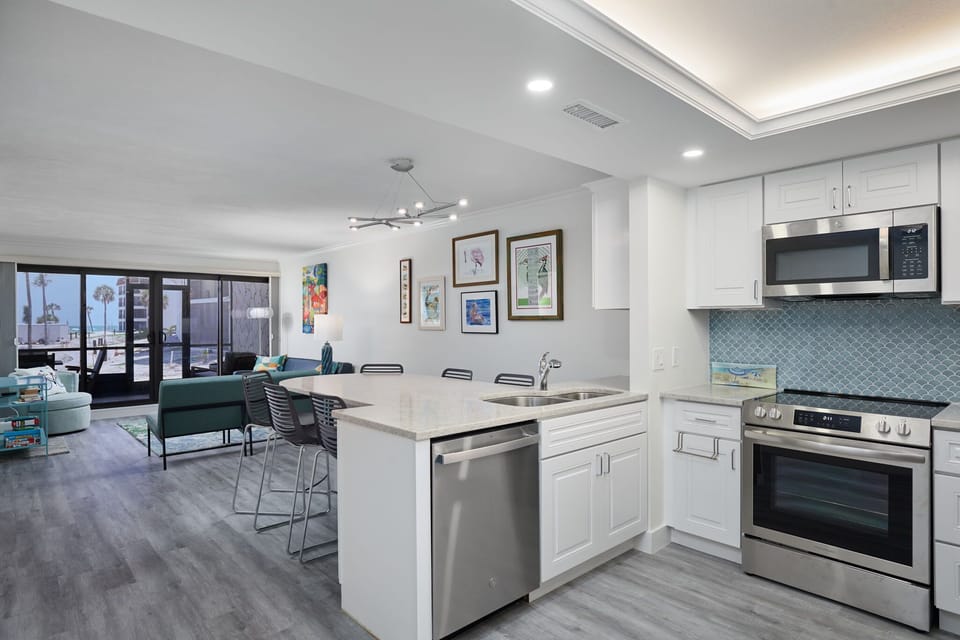 Full kitchen with stainless steel appliances.