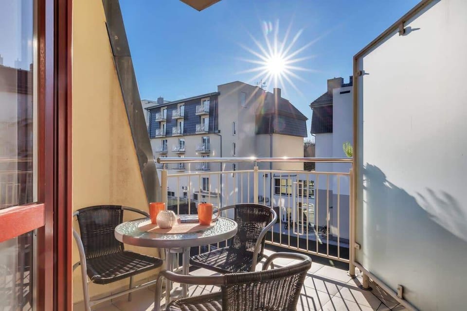 The living area opens up to a balcony, perfect for enjoying the nice vievs and air.