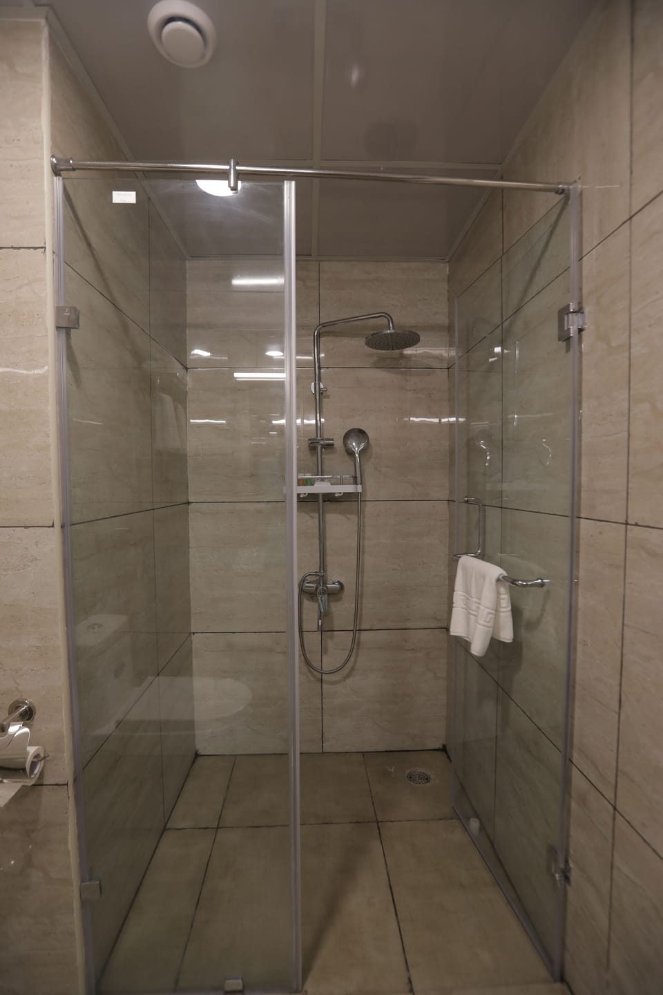 Shower, free toiletries, slippers, towels