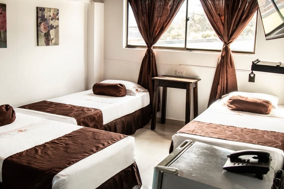 Family Triple Room | Minibar, desk, blackout drapes, iron/ironing board (on request)