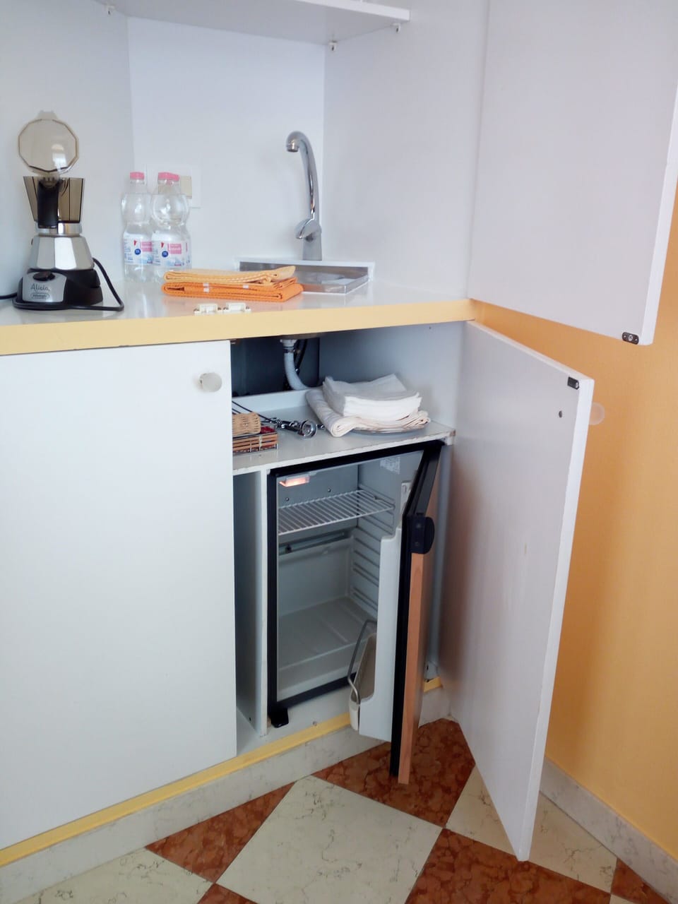 coffee and tea corner with small refrigerator