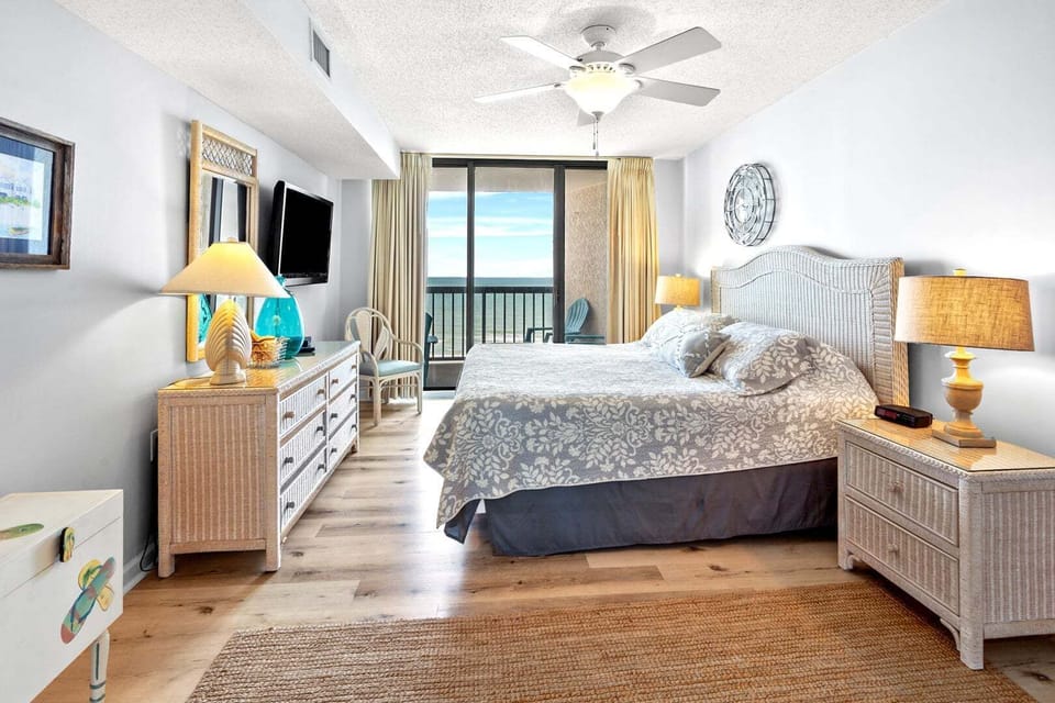 Bedroom with ocean views and sliding doors to the balcony at Ocean Bay Club 703 in Ocean Drive, North Myrtle Beach