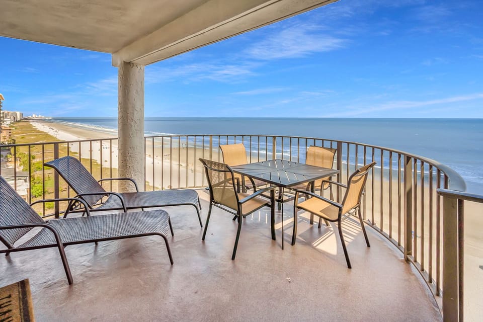 Oceanfront balcony with lounge seating at Sea Castle 8C, a 3-bedroom Crescent Beach condo rental in North Myrtle Beach