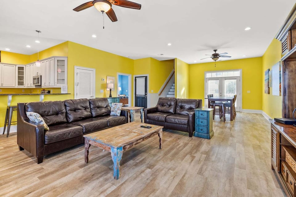 Living area opening to the kitchen and dining space at A Perfect Escape, a Cherry Grove beach house rental