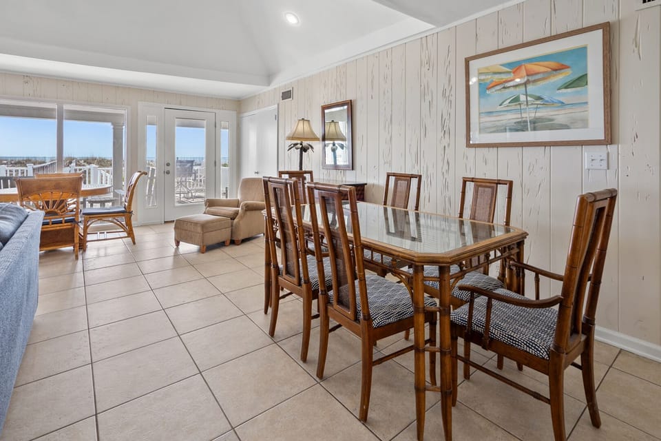 Beach artwork above the dining table beside the balcony doors at Moonfish on Tilghman Beach