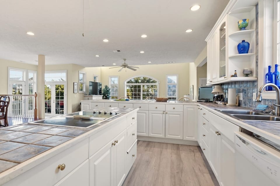 Island cooktop and double sink under wide windows at Rest-A-Bit 2, Tilghman Beach, North Myrtle Beach