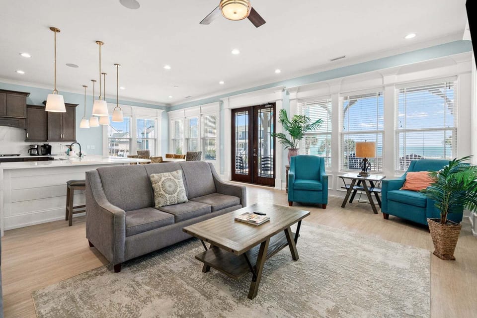 Open living space with ocean views and island seating at A New Beginning, a 7-bedroom vacation rental in Cherry Grove