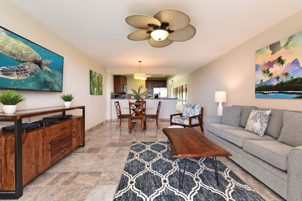 Living area features comfortable sleeper sofa, perfect for extra sleeping arrangement