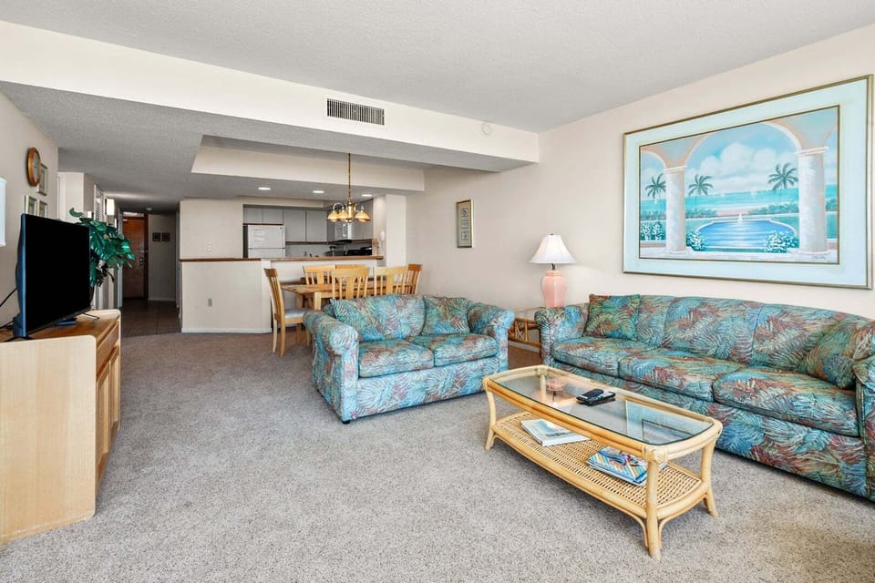 Two sofas and a wide TV wall in the living room at Shoreham Towers II 2D, a Crescent Beach vacation rental