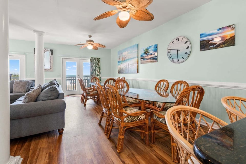 Sea-themed art above the dining table with ocean views at Diamond Dunes A in Crescent Beach