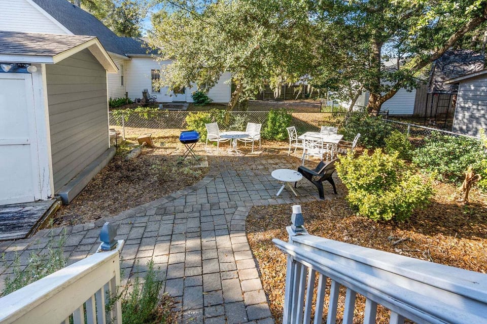 Backyard patio with a grill, table and chairs at Blue Atlantic, a 4-bedroom Ocean Drive vacation rental