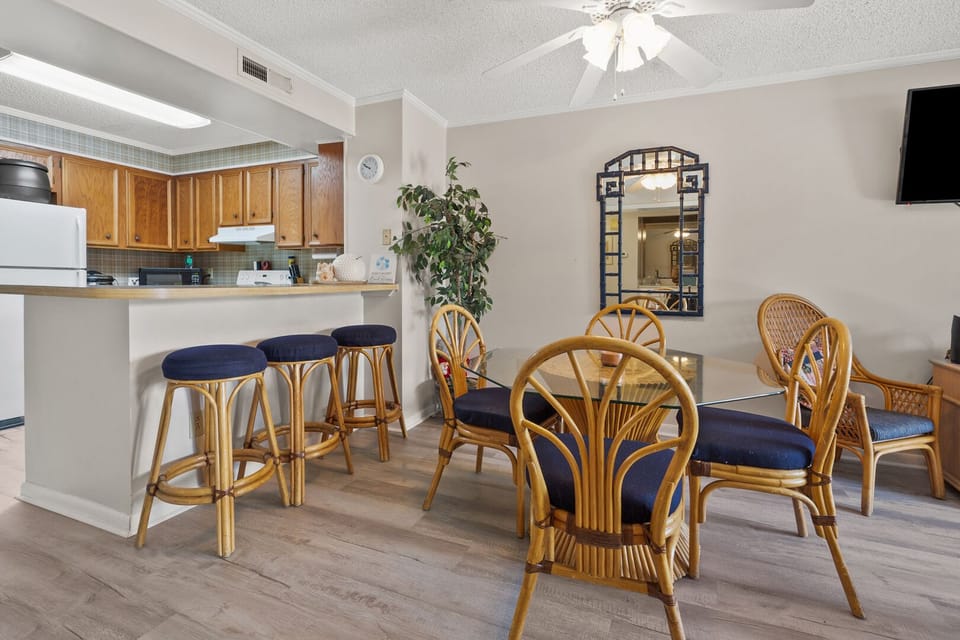 Breakfast bar seating beside the dining table at Tilghman Beach & Racquet Club 140, Ocean Drive vacation rental
