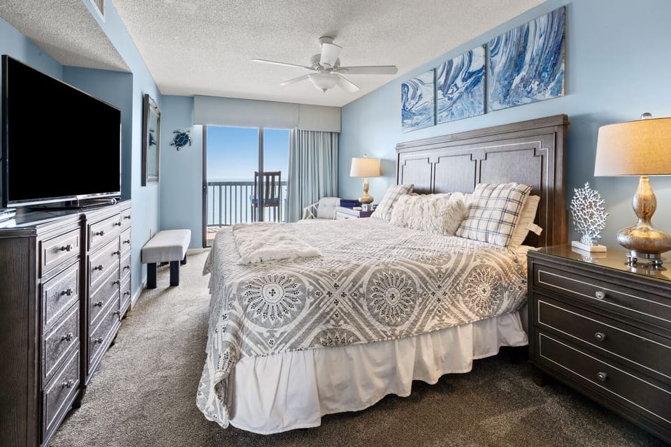 Bedroom with balcony doors framing the ocean at Ocean Bay Club 1504, Ocean Drive, North Myrtle Beach