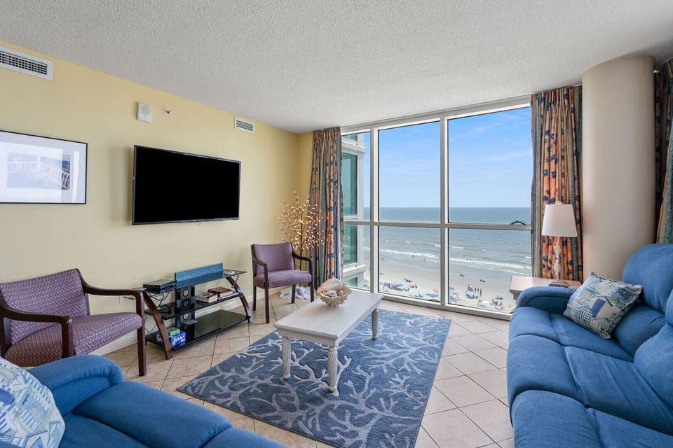 Living area with sliding doors to the balcony and ocean views at Avista Ocean Resort 801, Ocean Drive