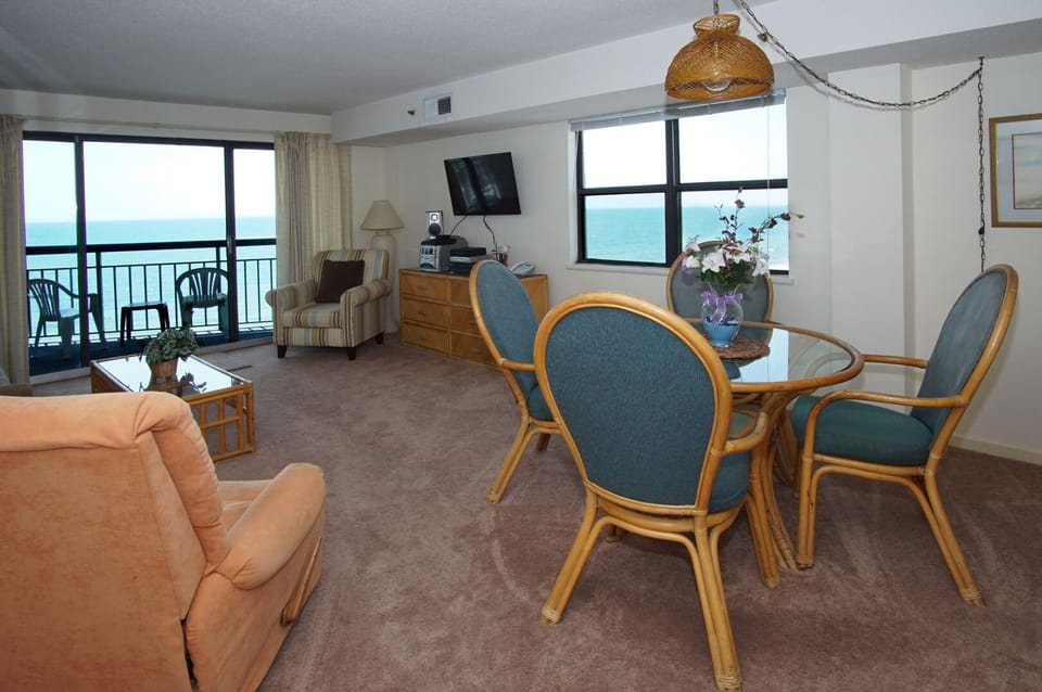 Open living and dining space with ocean views at Oceans 1116, Cherry Grove, North Myrtle Beach