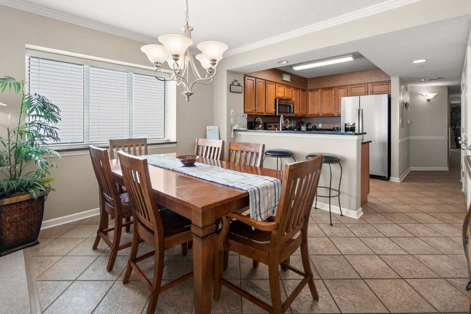 Dining table for six beside the kitchen bar at South Shore Villas 1207, Crescent Beach, North Myrtle Beach