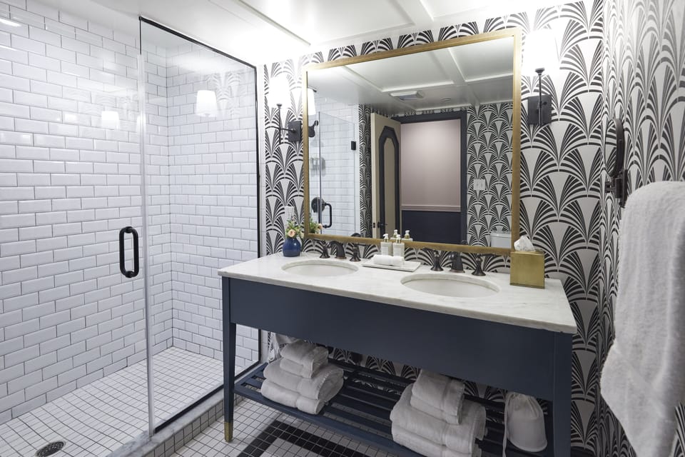 Designer toiletries, hair dryer, bathrobes, towels