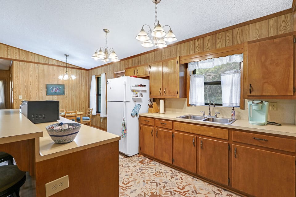 Kitchen has lots of available counter space for food preparation.