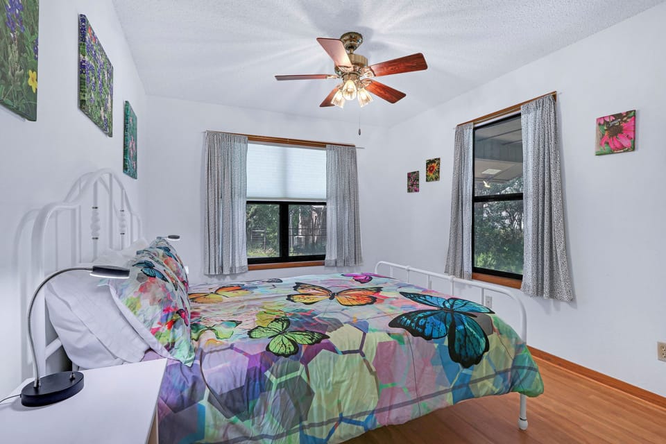 Bedroom 1, which is across the hall from the bathroom has a queen bed.