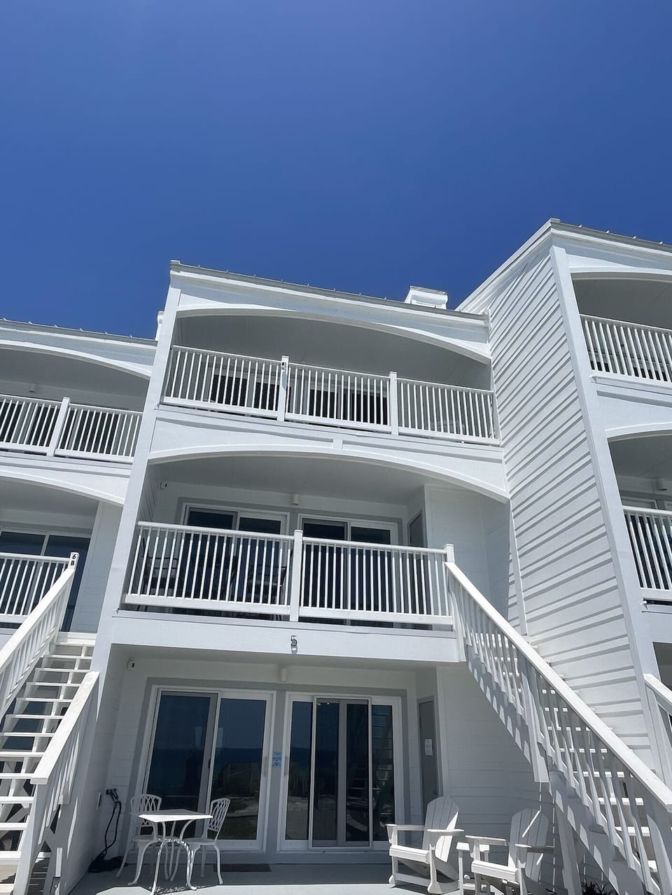 The 2 top balconies are included with this unit.