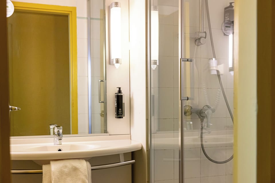 Shower, eco-friendly toiletries, hair dryer, towels