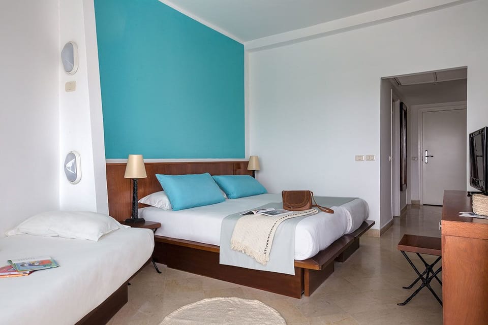 Standard Triple Room, Garden View | Select Comfort beds, minibar, in-room safe, desk