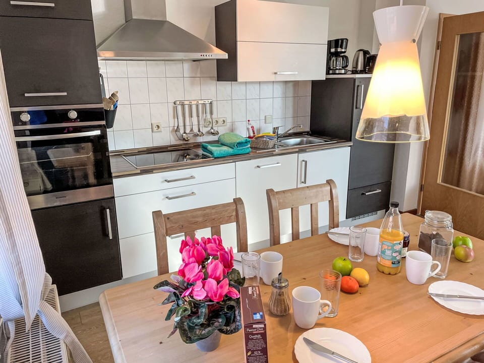 Furniture, Kitchen, Kitchen Appliance, Countertop, Interior Design, Flooring, Major Appliance, Floor, Wood, Chair