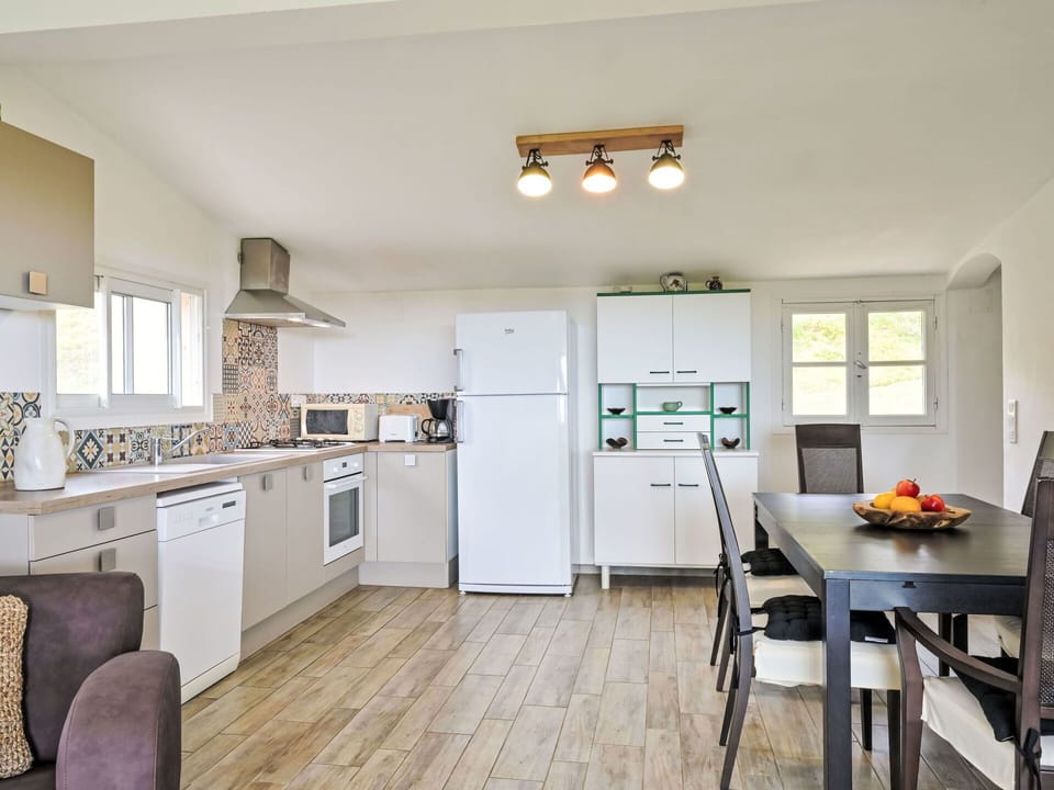 Cabinetry, Furniture, Countertop, Kitchen Appliance, Kitchen Stove, Kitchen, Chair, Wood, Home Appliance, Flooring