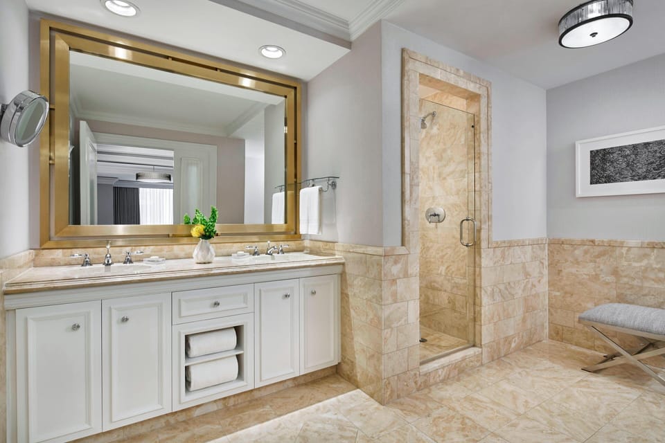 Separate tub and shower, designer toiletries, hair dryer, bathrobes