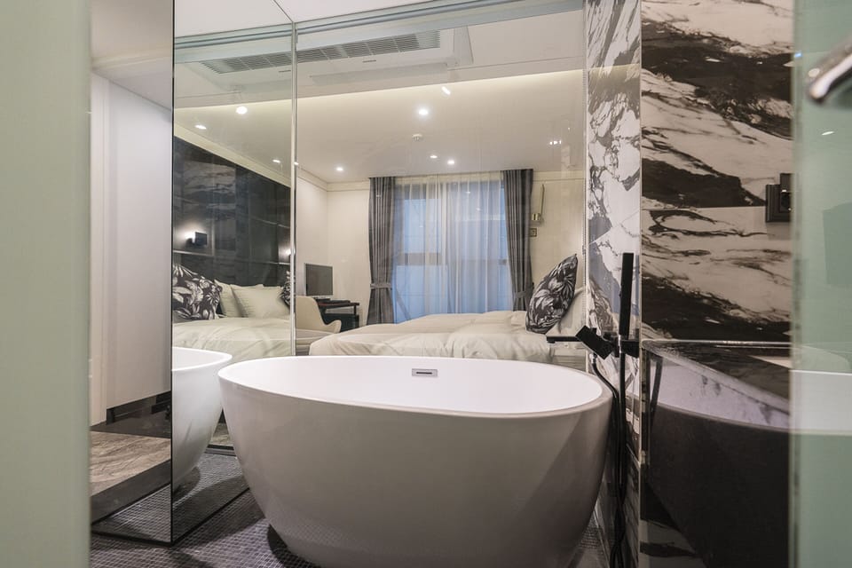 Deluxe Twin | Bathroom | Separate tub and shower, hair dryer, bathrobes, slippers
