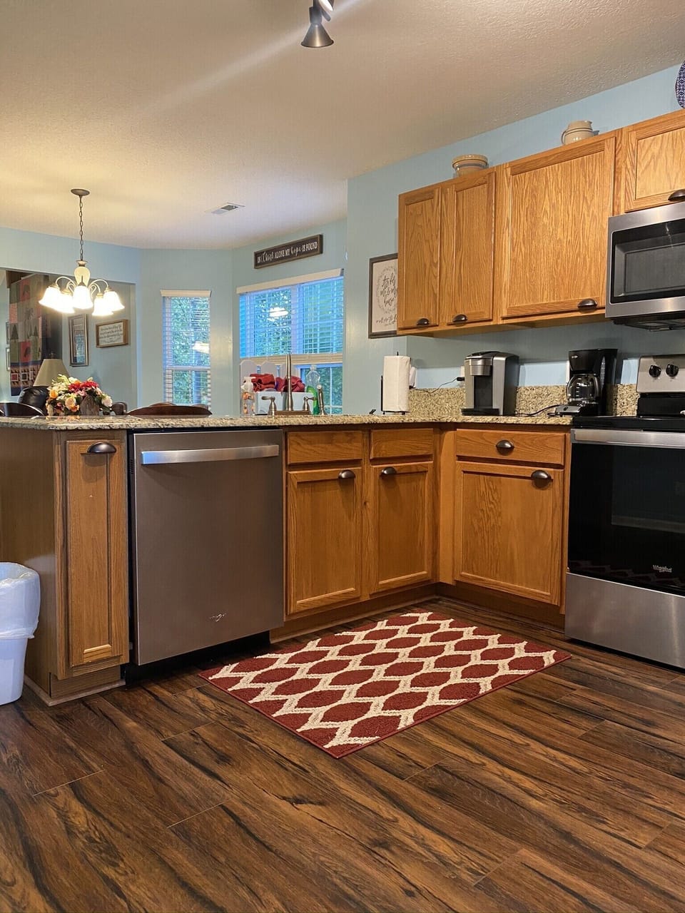 Kitchen open to dining area with bar seats 3, 2 coffee makers, slow cooker mixer