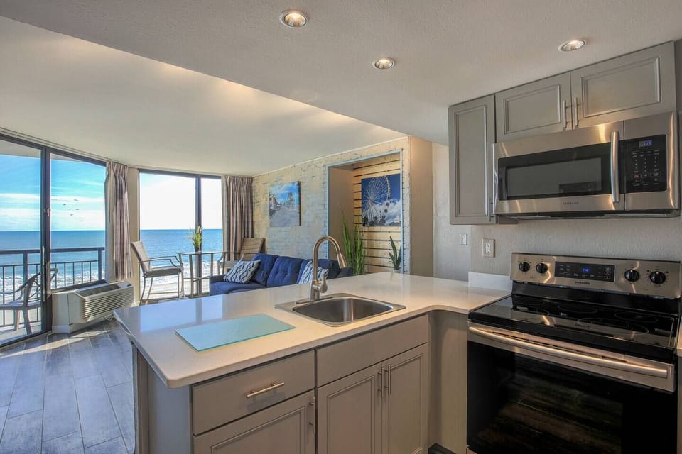 Enjoy a bright and airy cooking space in our suite's kitchen, where ample natural light complements the contemporary design.